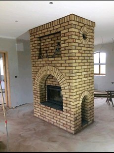 Bespoke brick fireplace design from Brendan Mullen