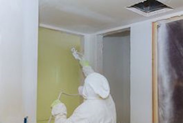 Image shows interior walls in Westmeath being spray-painted by Joe Kelly Total Decorating Solutions