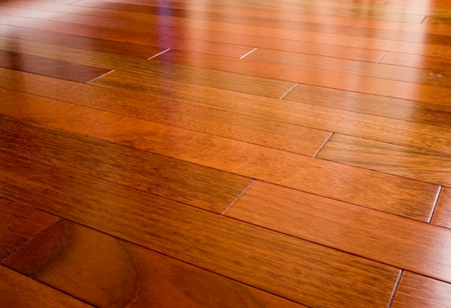 Image shows wooden floor polished by Expert Floor Care.