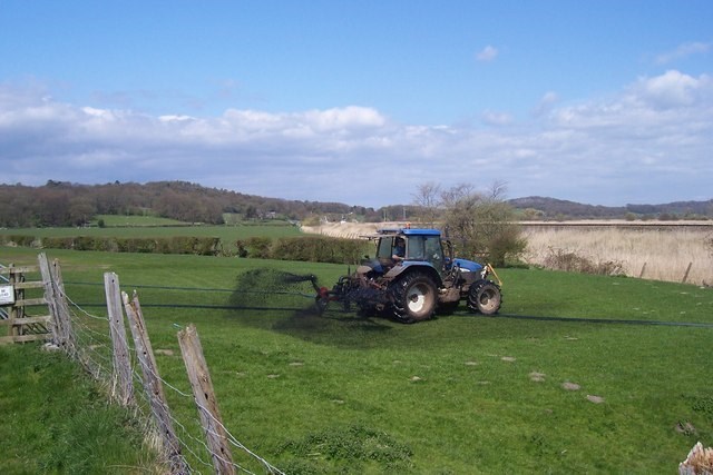 Image of tractor spreading slurry a service provided by C Gallagher Agri Contractor in Westmeath.